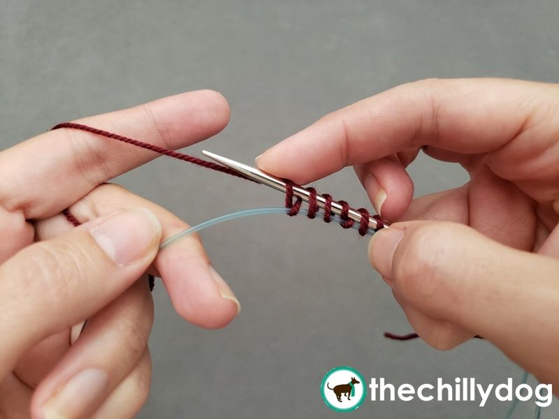 How to do the provisional cast on in the round around a spare cord or a piece of waste yarn.