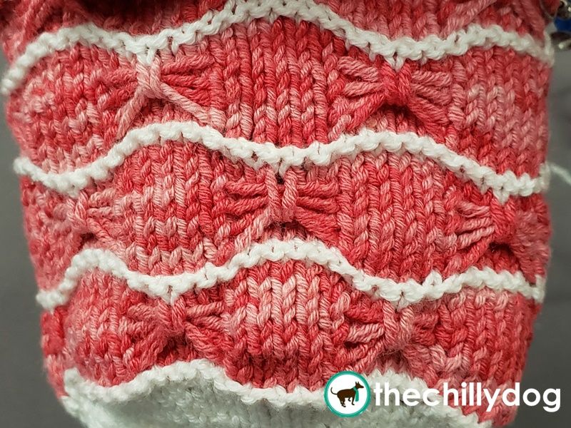 An ornamental stitch usually worked on a background of stockinette stitch.