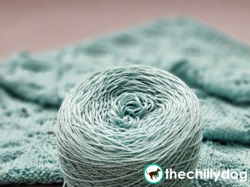 Attaching the next cake of yarn.