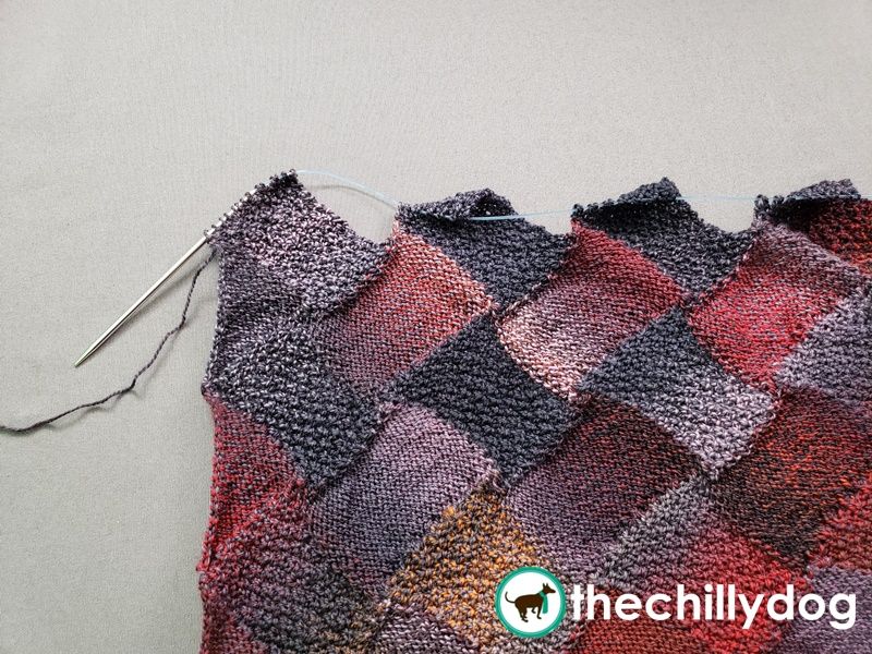 Entrelac rectangles created by picking up stitches when the wrong side is facing you.