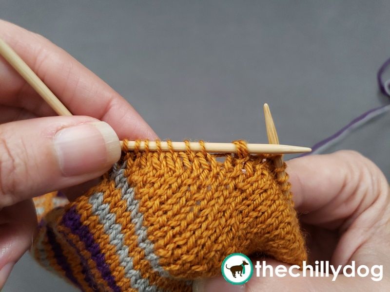 Adding extra rounds between the first and second half of the heel shaping.