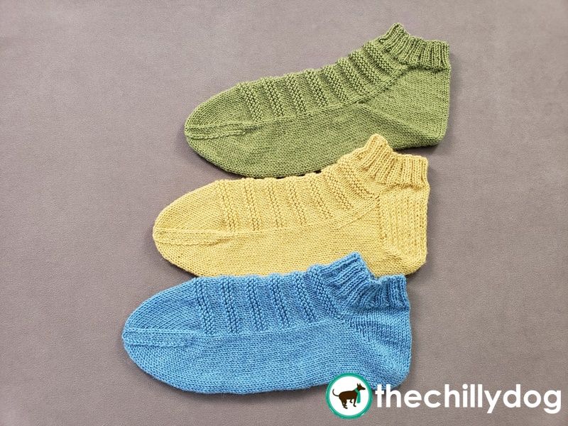 Comparing socks with short row, flap and gusset, and (flapless) gusset heel shaping.